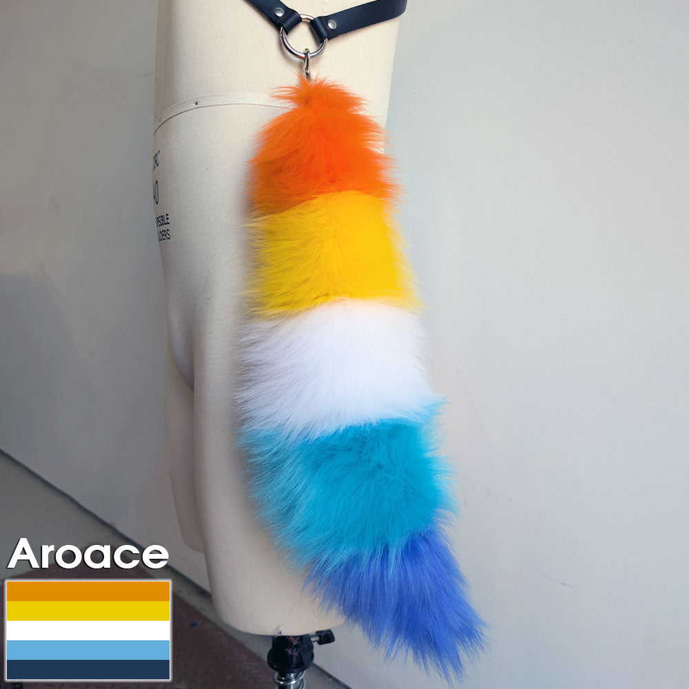 Pawstar branded gay pride keychain furry tail in the aroace flag.