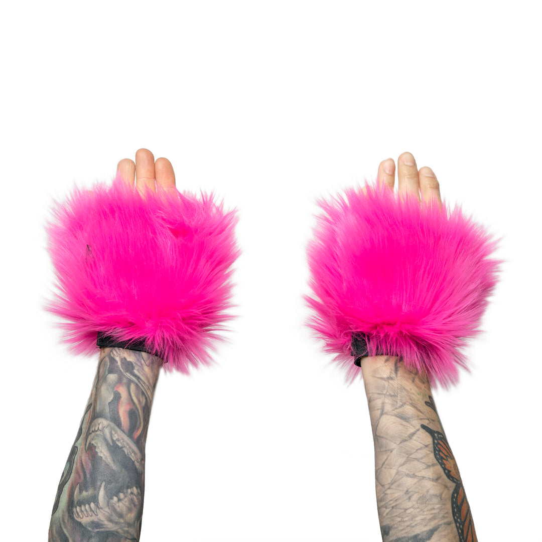 hot pink Monster Fur Fluffy Cuffs by Pawstar! Furry wrist cuffs made from faux fur for raves, cosplays, halloween, music festivals, and more.