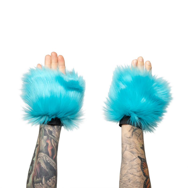 turquoise Monster Fur Fluffy Cuffs by Pawstar! Furry wrist cuffs made from faux fur for raves, cosplays, halloween, music festivals, and more.