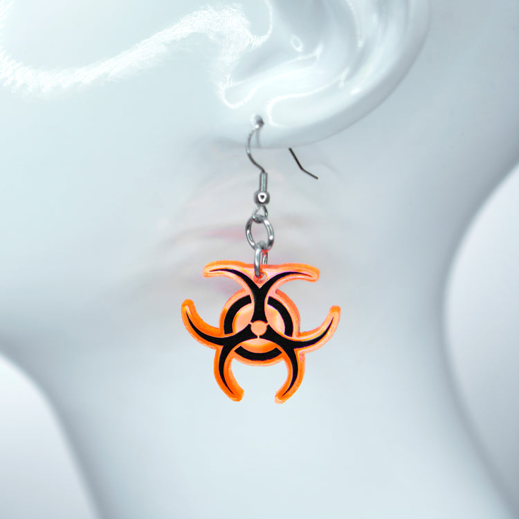 orange  Pawstar Biohazard Earrings - acrylic laser cut biohazard cybergoth earrings. made in the usa